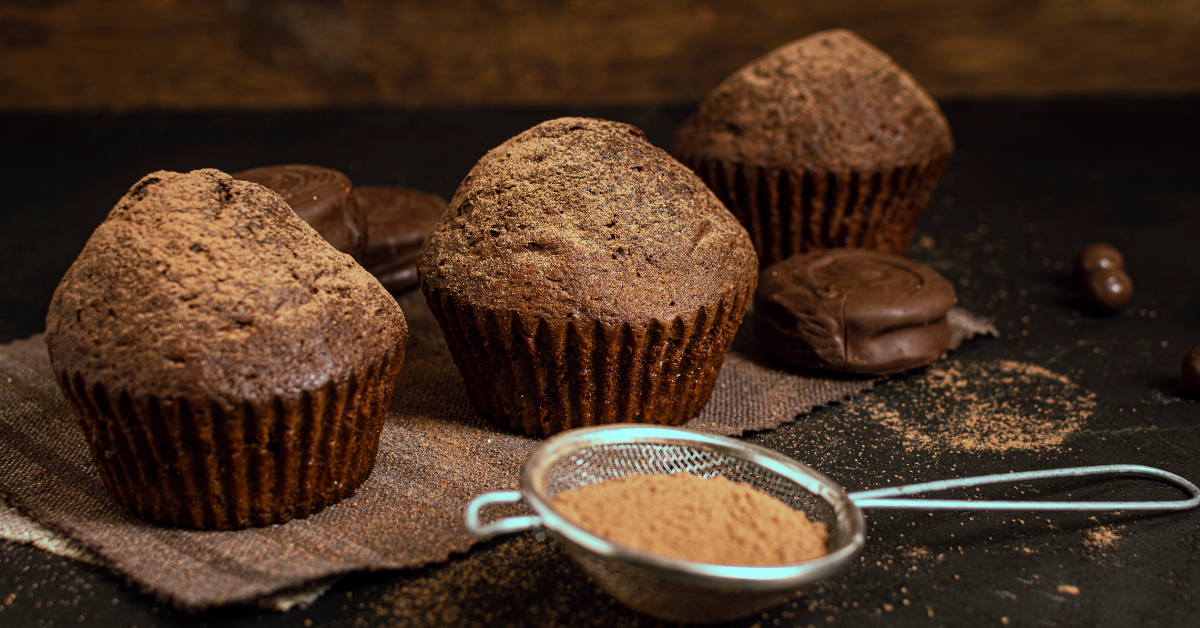 Freshly baked chocolate protein muffins cooling on a wire rack