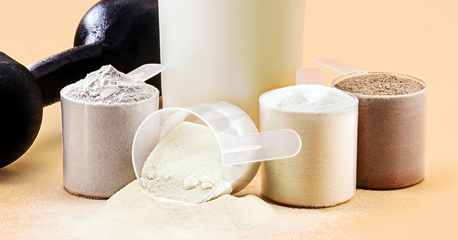 Array of different protein powder types and containers showing lactose-free options