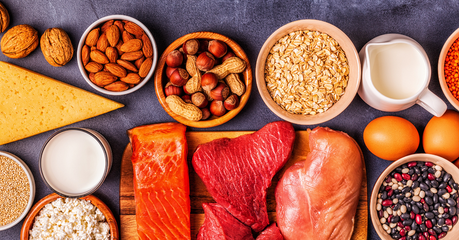 Flat lay of alternative protein sources including beef, eggs, collagen, and seeds