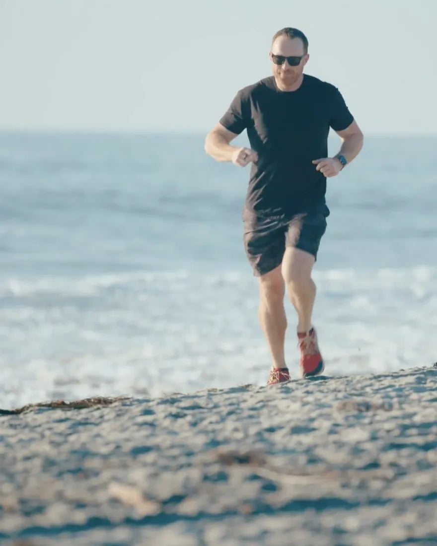 Doug, founder of PaleoPro, running on the beach