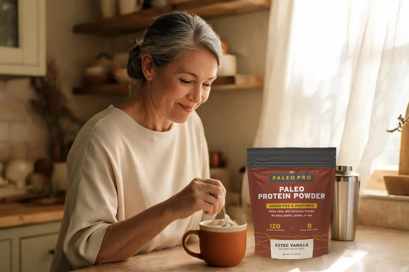 Woman stirring Paleo Pro into her morning coffee