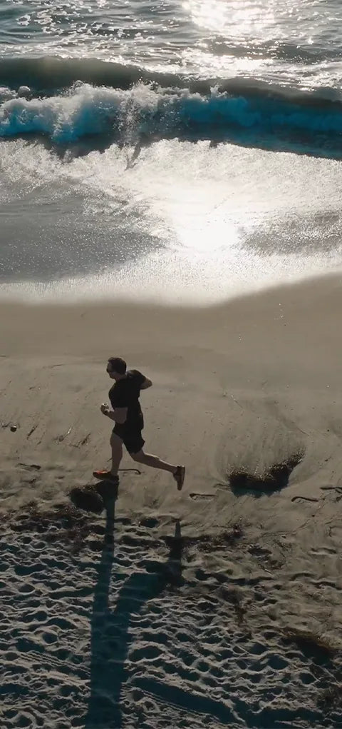 Doug running on the beach at sunrise